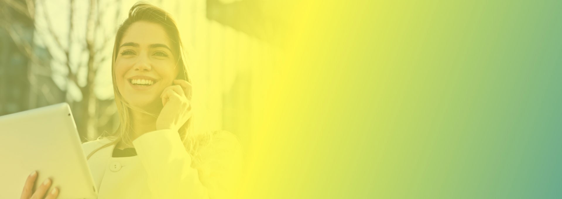 Faded background image of a lady holding a cell phone and tablet.